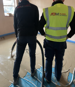 ADM Floor Screed Workers Pouring Liquid Screed